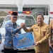 Penyerahan 5 Ambulans KORPRI kepada Mendagri untuk Bencana di Sumatra